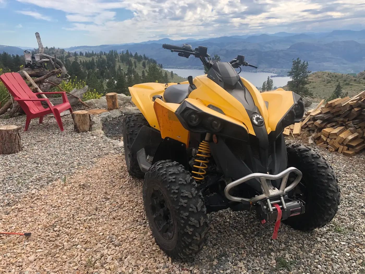 Yellow Can-Am ATV quad on Vista Peak mountain property with Osoyoos Lake view